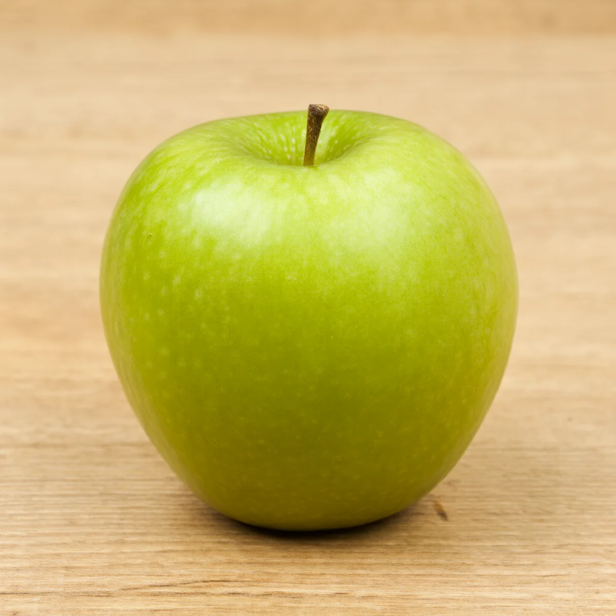 Green apple on a wooden table, generated by the workflow
